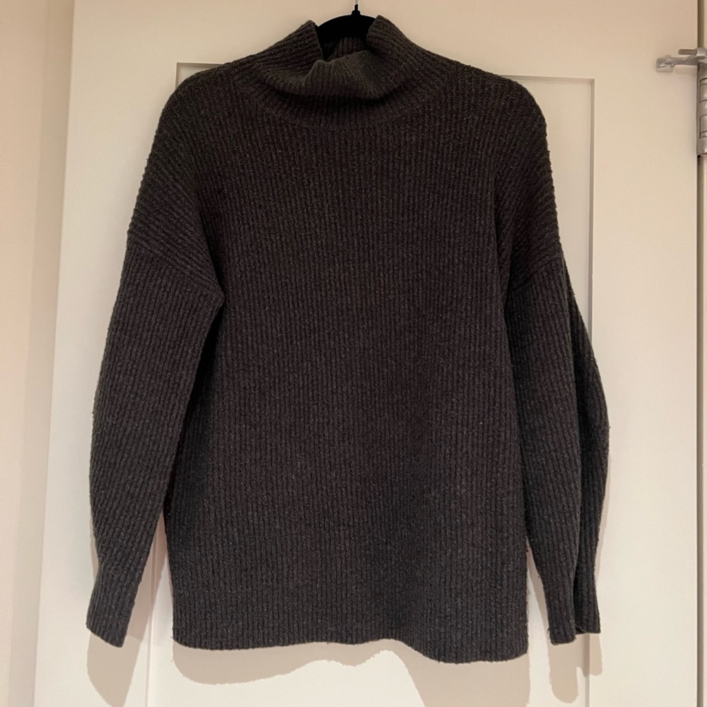 Green turtleneck sweater
